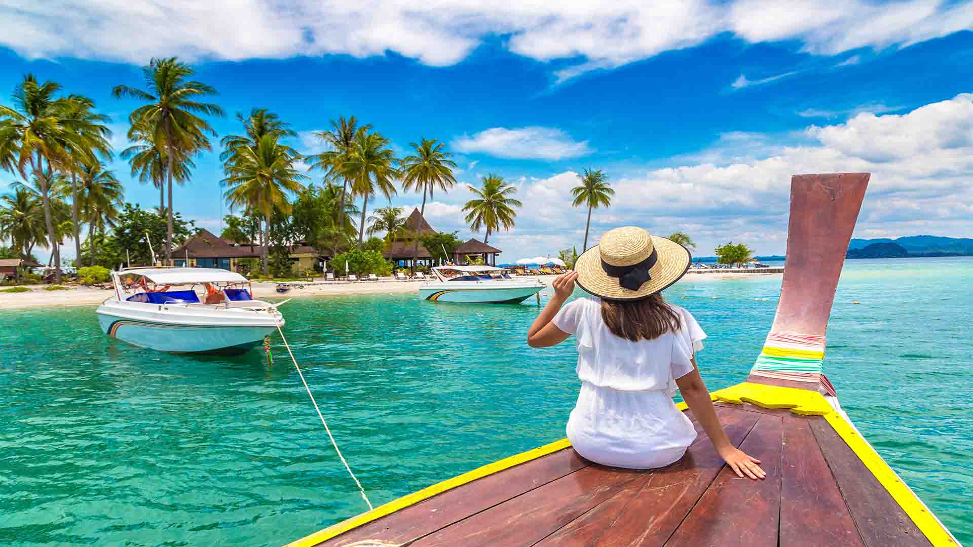 Happy traveler woman relaxing on boat near tropical island in Thailand; Shutterstock ID 2037856859; other: -; purchase_order: -; client: -; job: -